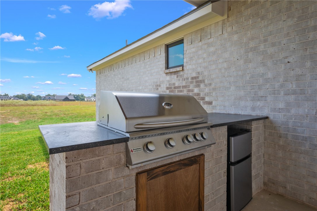 7888 Mathis Crk Drive Bryan, TX 77808 - Photo 34 of 41 View of patio / terrace with an outdoor kitchen