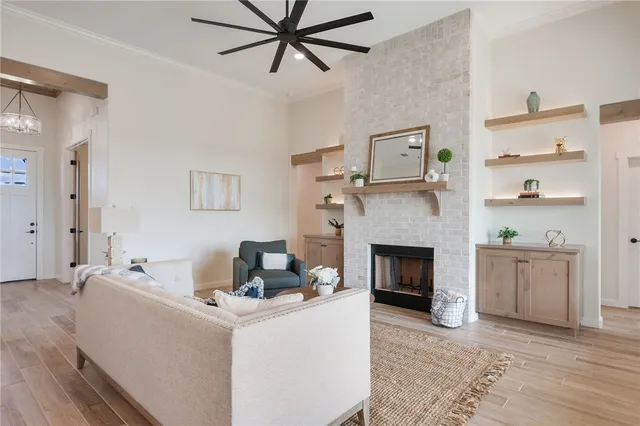 a living room with furniture and a fireplace