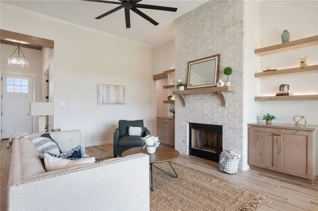 a living room with furniture and a fireplace