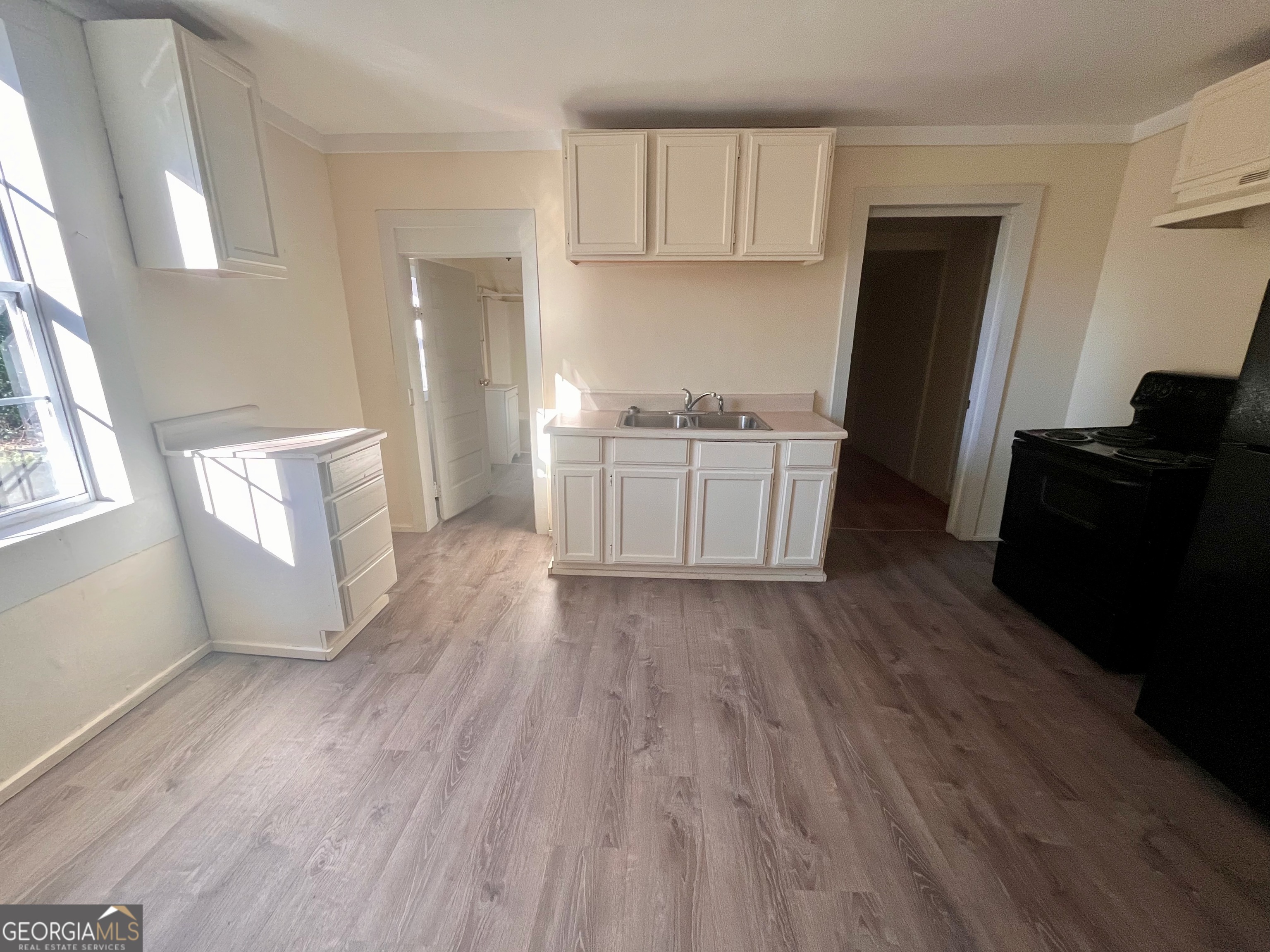 1202 Juniper Street LaGrange, GA 30240 - Photo 5 of 15 a kitchen with granite countertop a refrigerator a sink dishwasher and a stove top oven
