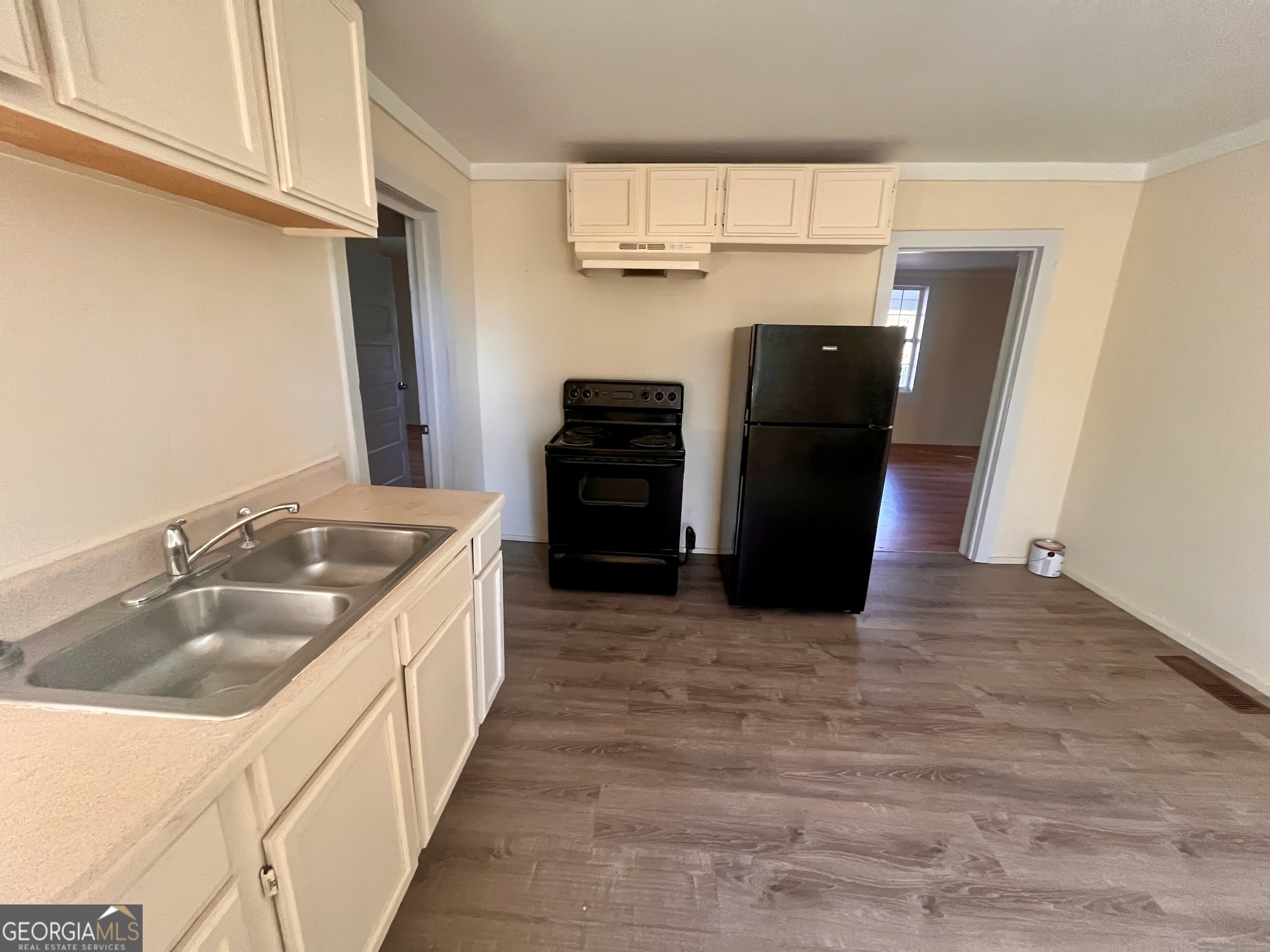 1202 Juniper Street LaGrange, GA 30240 - Photo 7 of 15 a kitchen with stainless steel appliances granite countertop a refrigerator and a sink