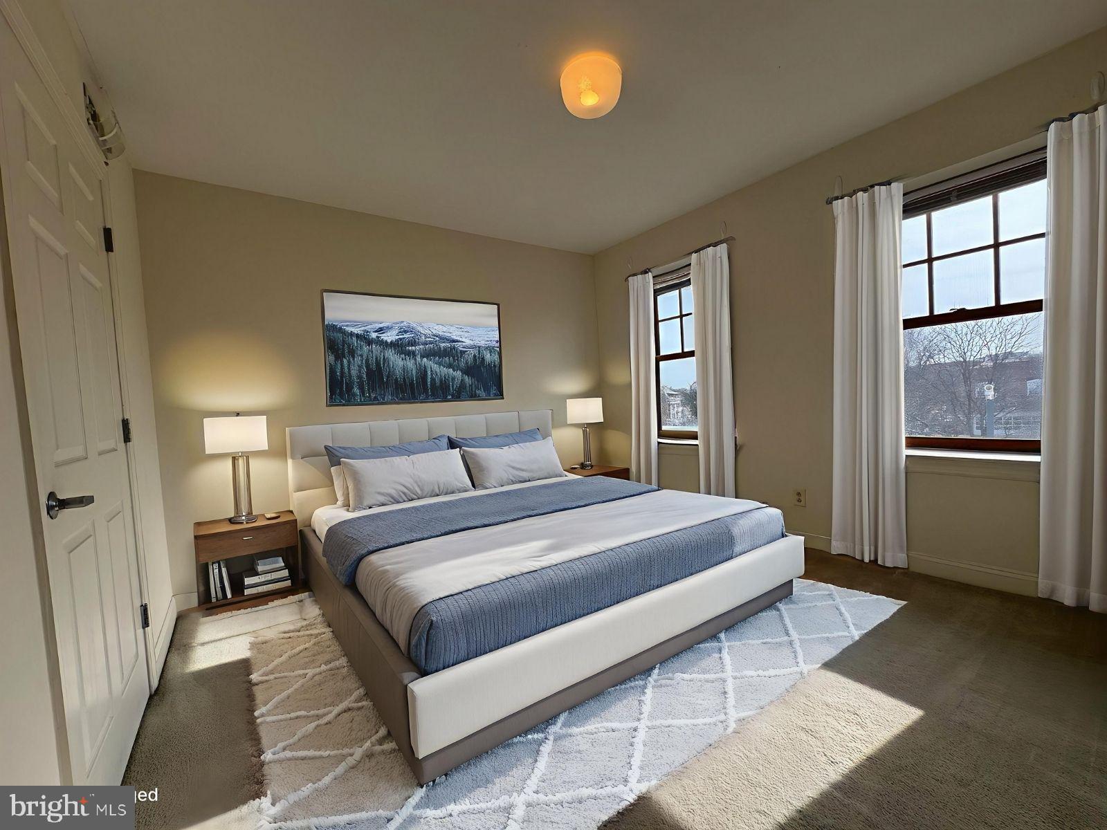 714 West Avenue, Unit 2 Jenkintown, PA 19046 - Photo 15 of 19 a bedroom with a large bed and a window