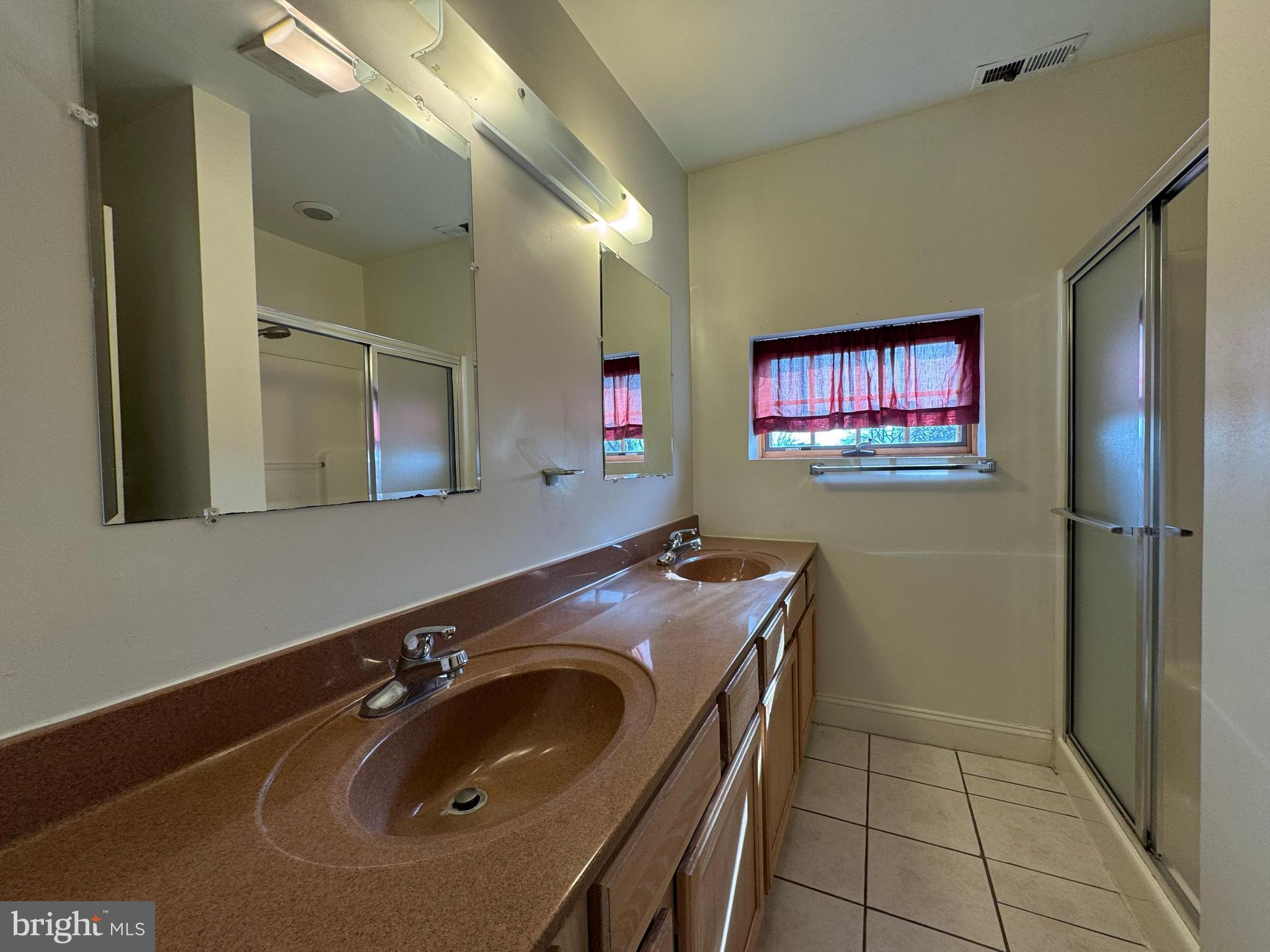 714 West Avenue, Unit 2 Jenkintown, PA 19046 - Photo 16 of 19 a bathroom with a sink a vanity and a mirror