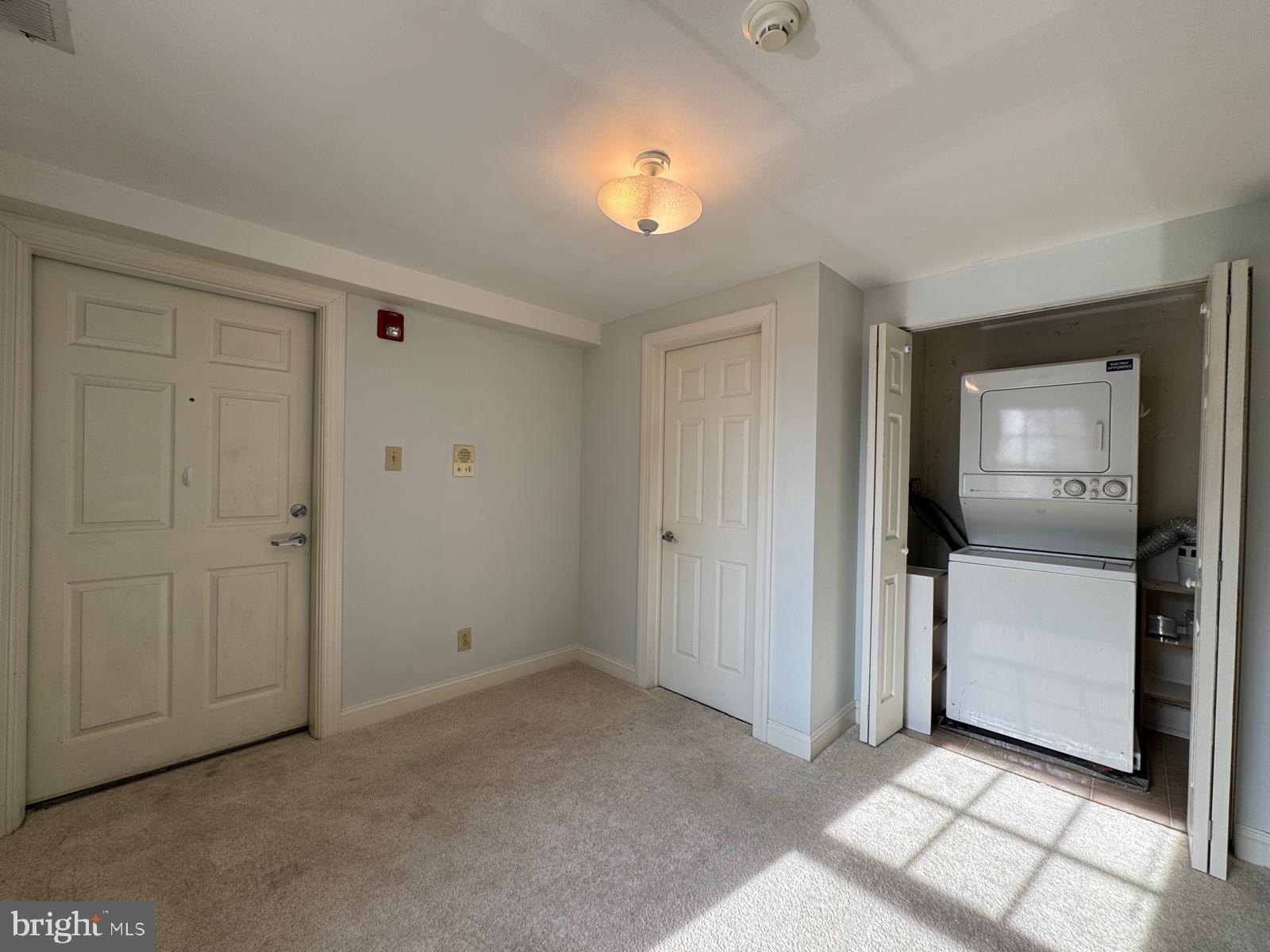 714 West Avenue, Unit 2 Jenkintown, PA 19046 - Photo 5 of 19 a view of a livingroom with an empty space and a window