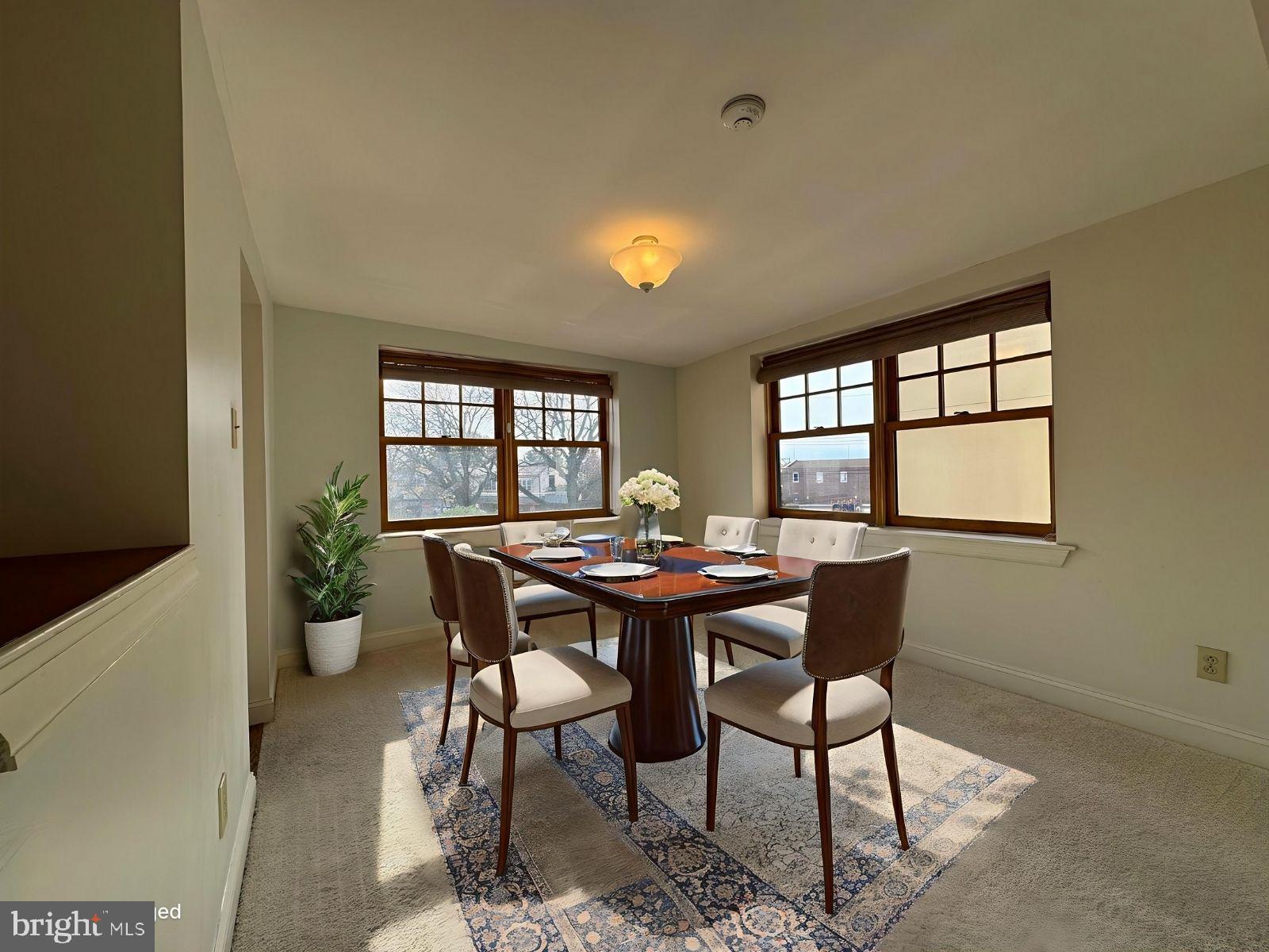 714 West Avenue, Unit 2 Jenkintown, PA 19046 - Photo 8 of 19 a dining room with furniture a potted plant and a potted plant