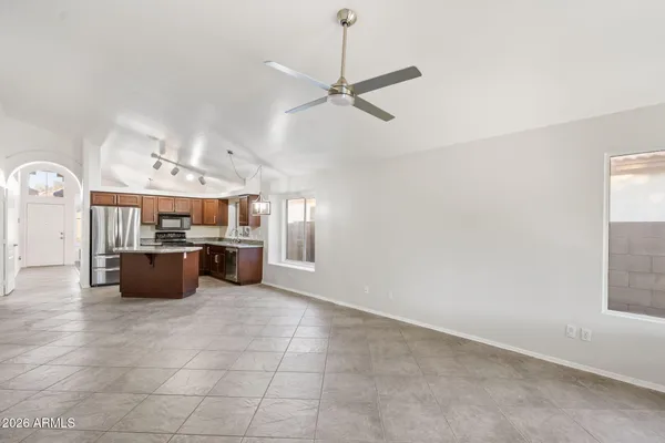 a large kitchen with a stove and cabinets