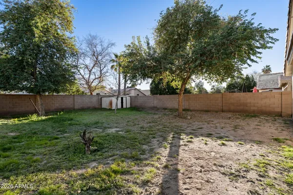 a view of backyard with green space