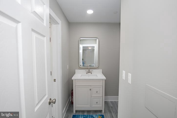 27068 Annie Hyland Road Princess Anne, MD 21853 - Photo 11 of 12 a bathroom with a sink toilet and mirror