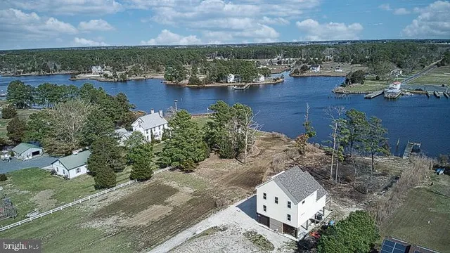 an aerial view of a house with a lake view