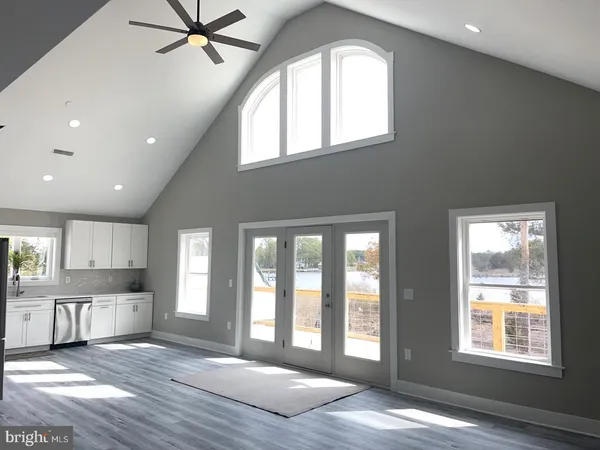 a view of a kitchen with a sink and a window
