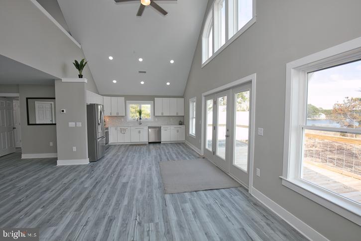 27068 Annie Hyland Road Princess Anne, MD 21853 - Photo 7 of 12 a view of empty room with wooden floor and windows