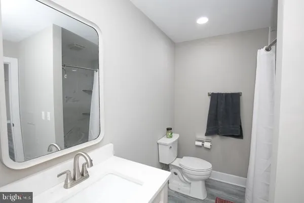 a bathroom with a toilet and a sink
