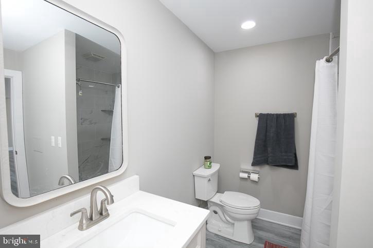 27068 Annie Hyland Road Princess Anne, MD 21853 - Photo 10 of 12 a bathroom with a toilet and a sink