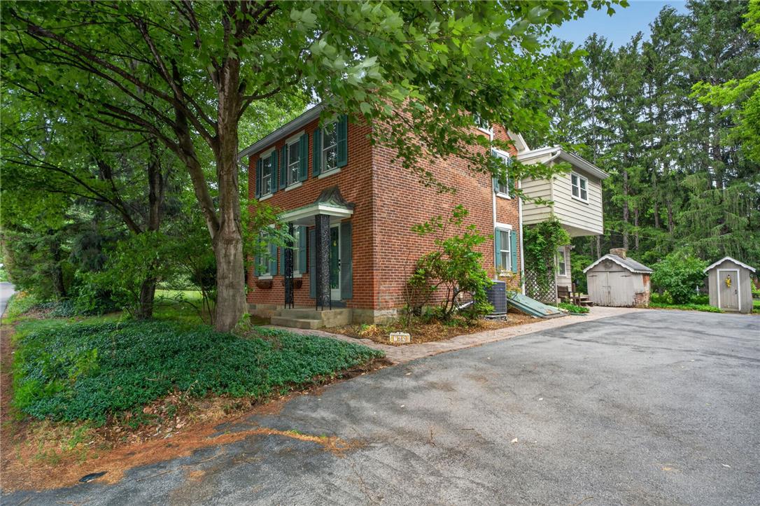 765 East Macada Road Bethlehem, PA 18017 - Photo 1 of 46 A classic brick exterior with charming green shutters and a verdant landscape awaits.