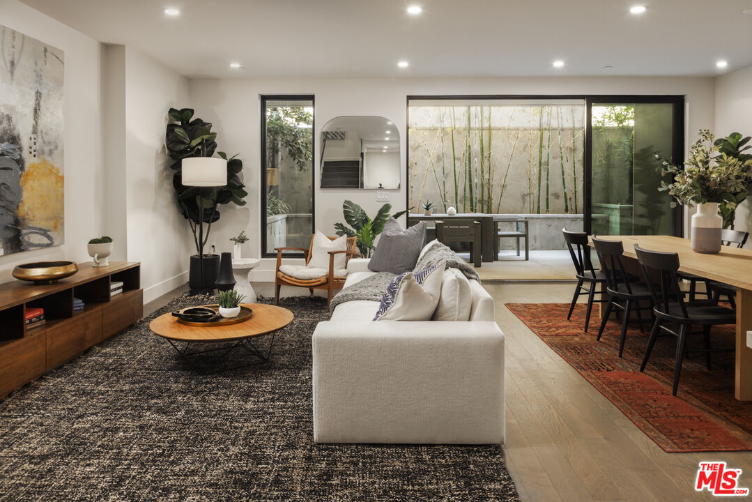411 South Hamel Road, Unit 106 Los Angeles, CA 90048 - Photo 3 of 17 a living room with furniture and a wooden floor