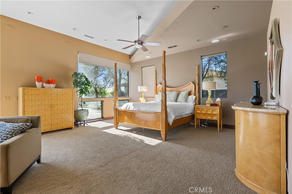 68 Royal St Georges Way Rancho Mirage, CA 92270 - Photo 44 of 75 a bedroom with furniture and a window