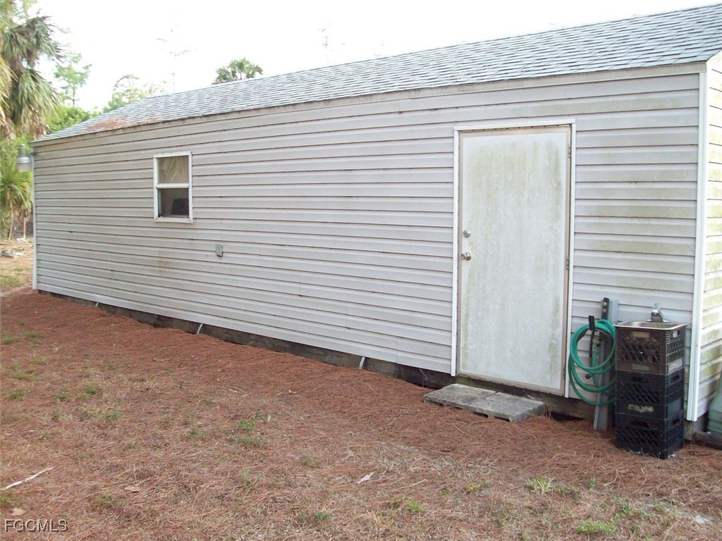 19790 Burgundy Farms Road Estero, FL 33928 - Photo 11 of 12 a view of a white house