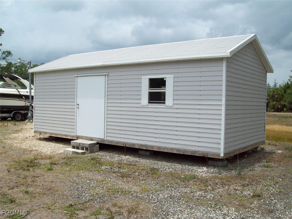 19790 Burgundy Farms Road Estero, FL 33928 - Photo 12 of 12 a view of a house with a backyard