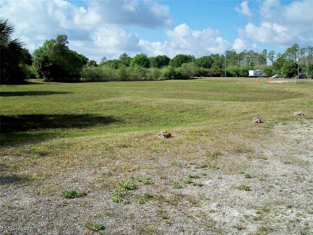 19790 Burgundy Farms Road Estero, FL 33928 - Photo 8 of 12 a view of a field with an trees