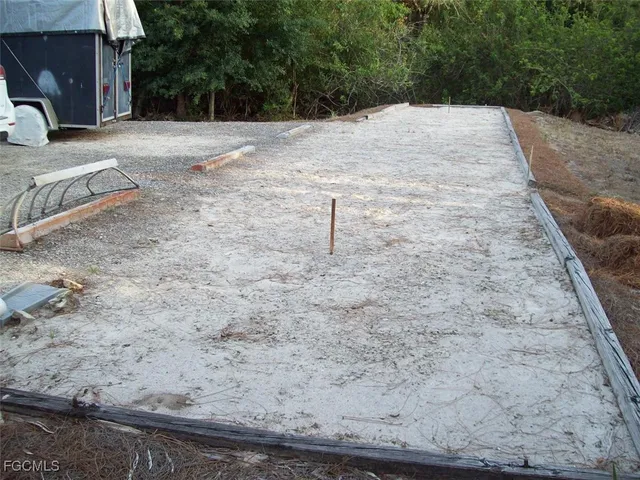 a view of a backyard of the house