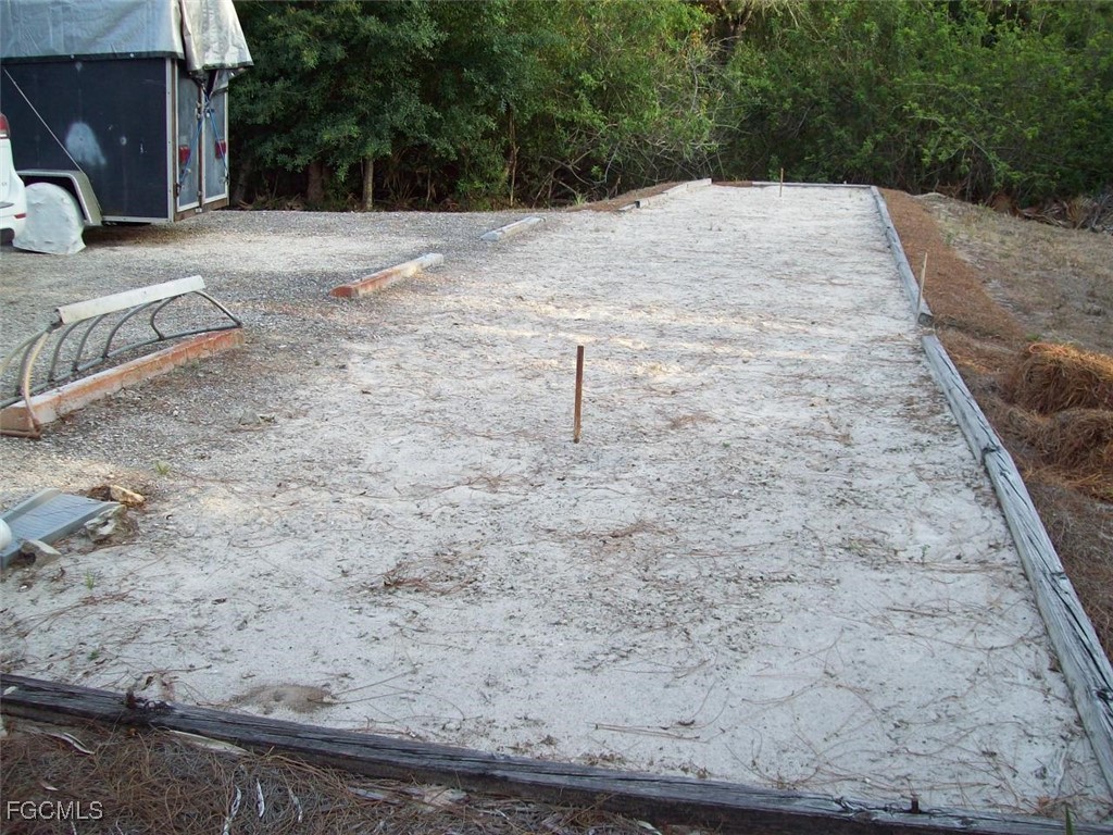 19790 Burgundy Farms Road Estero, FL 33928 - Photo 10 of 12 a view of a backyard of the house