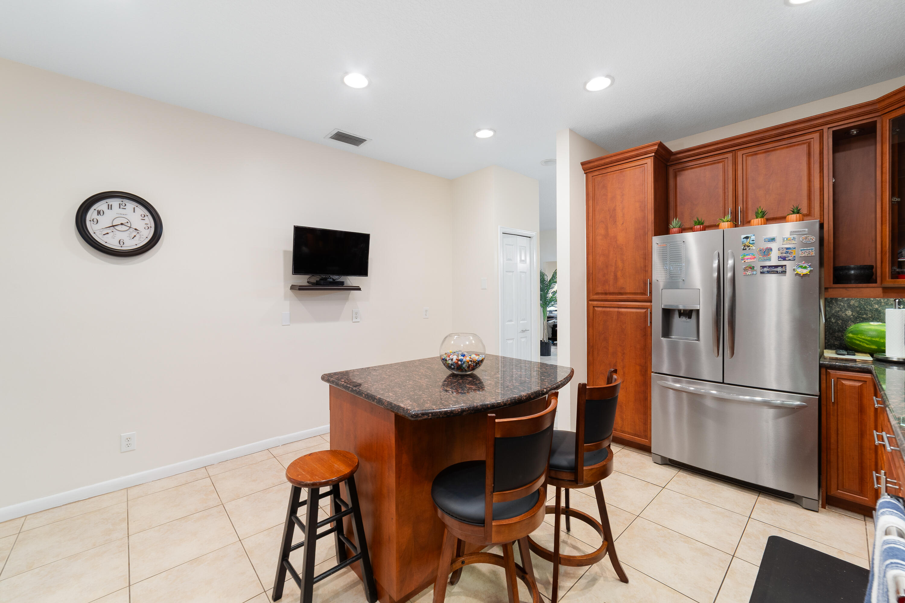 20508 Vía Marisa Boca Raton, FL 33498 - Photo 10 of 31 a kitchen with stainless steel appliances granite countertop a refrigerator a stove a sink and a refrigerator with wooden floor