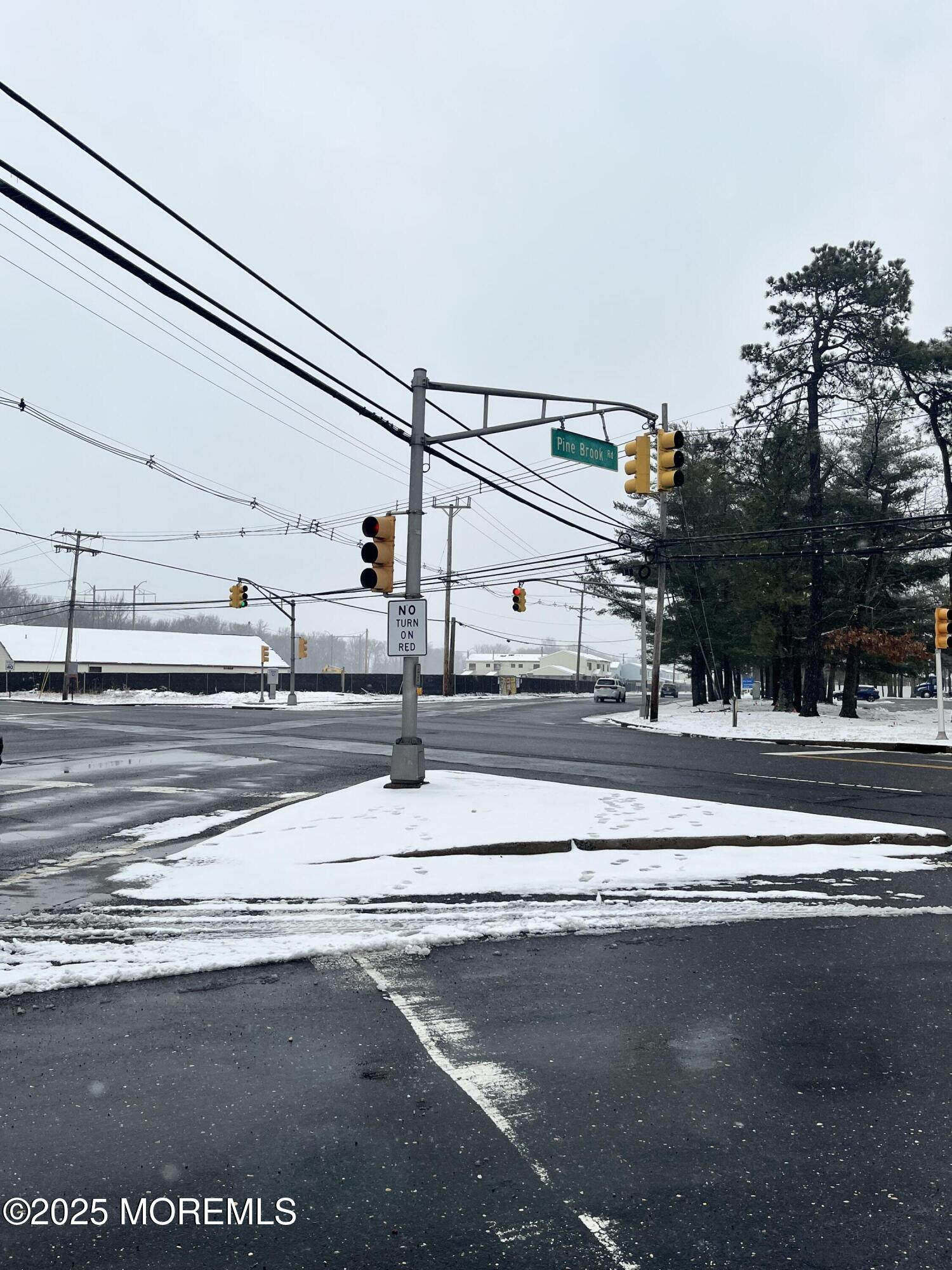 1114 Pinebrook Road Tinton Falls, NJ 07724 - Photo 3 of 4 a view of street with view of building