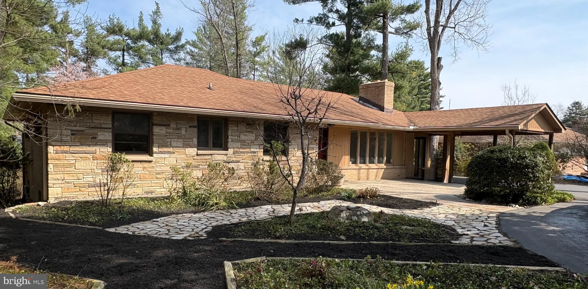 9714 Frederick Road Ellicott City, MD 21042 - Photo 1 of 1 a front view of a house with garden