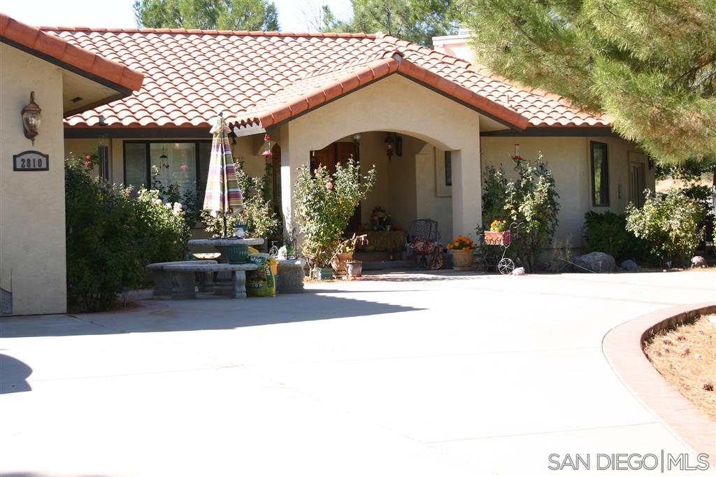 2808-10 Ribbonwood Road Boulevard, CA 91905 - Photo 1 of 25 a front view of a house with a yard