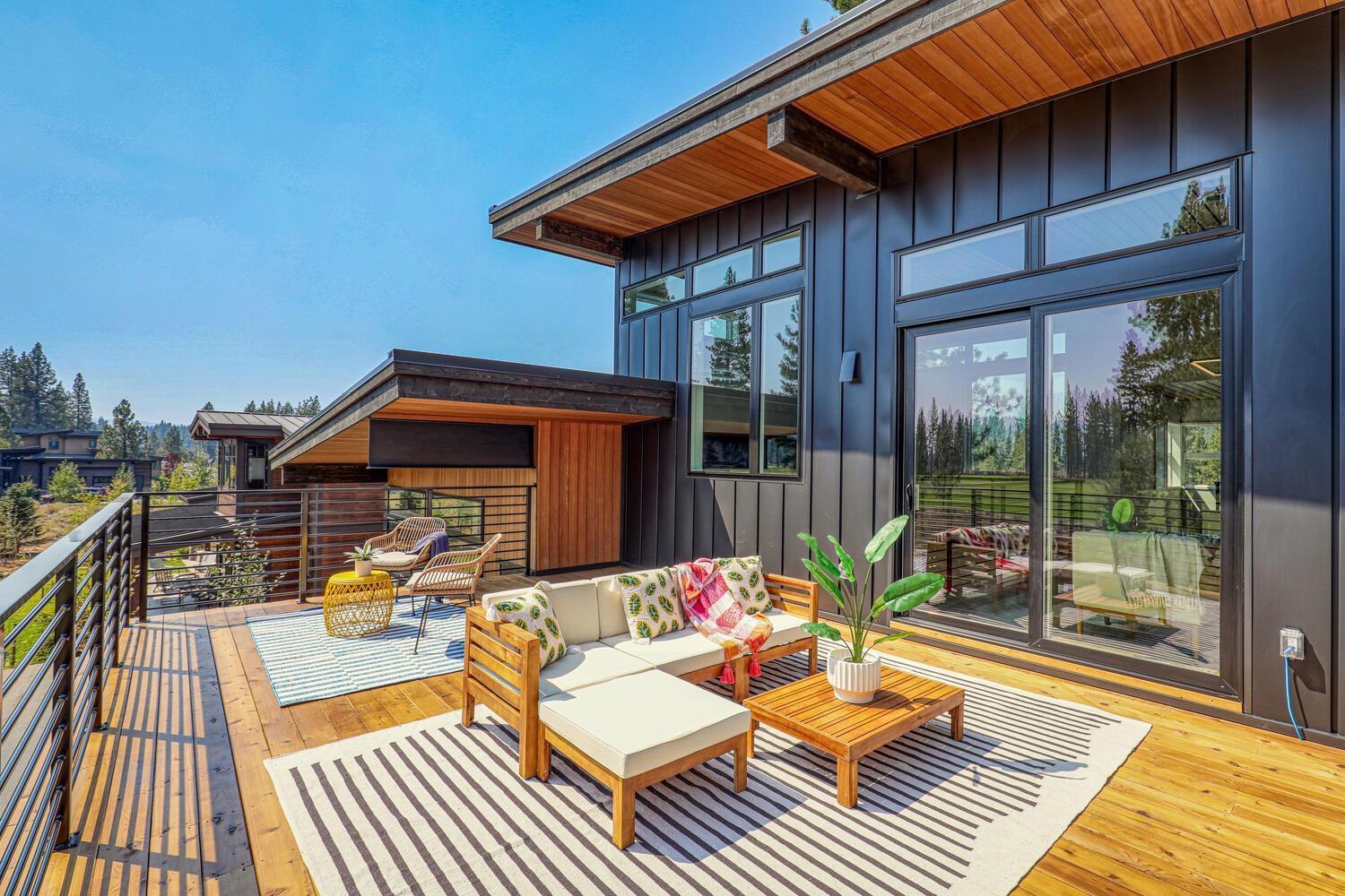 11614 Henness Road Truckee, CA 96161 - Photo 19 of 21 a view of a roof deck with wooden floor and fence