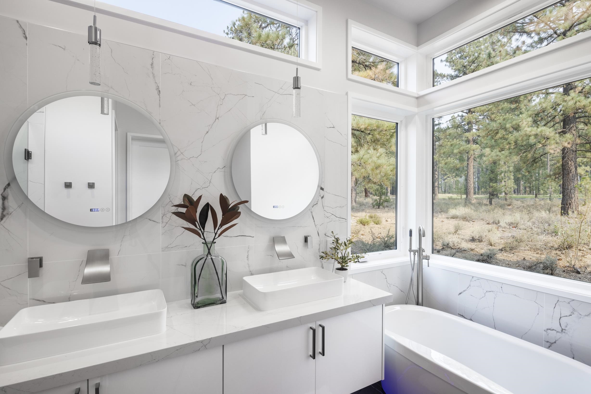 11614 Henness Road Truckee, CA 96161 - Photo 9 of 21 a bathroom with a double vanity sink and a mirror