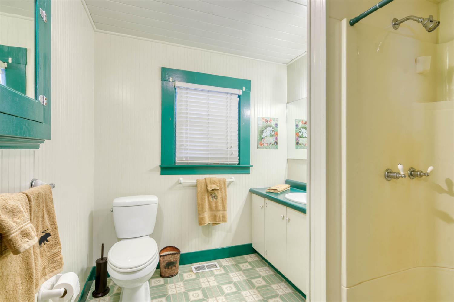 42025 Tollhouse Road Shaver Lake, CA 93664 - Photo 43 of 64 a white toilet sitting next to a bathroom sink