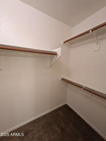 a view of an empty walk in closet