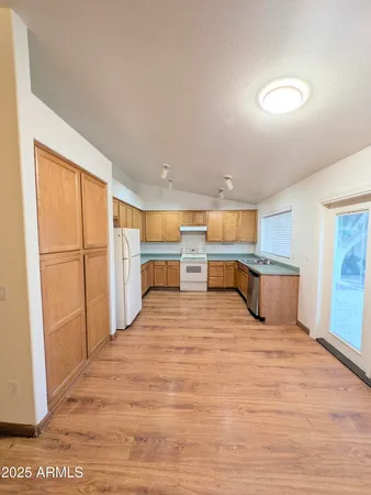 a view of kitchen with wooden floor
