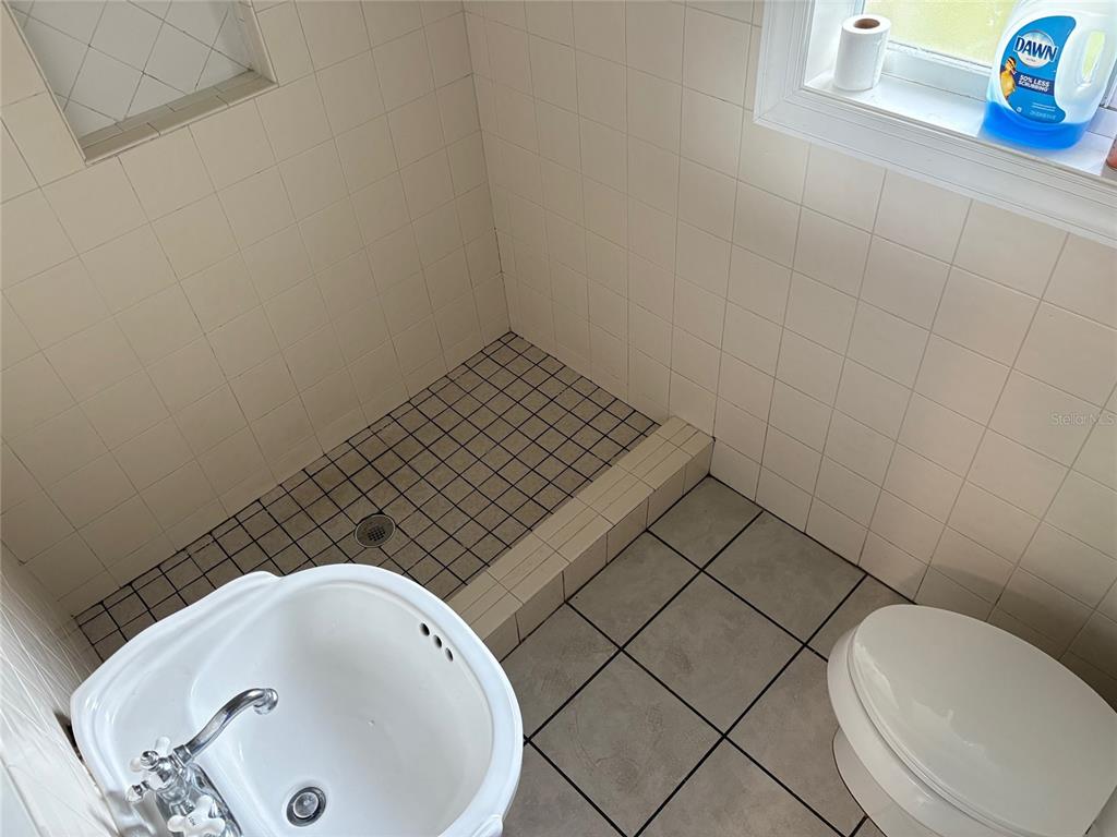 401 Northwest 36th Street Gainesville, FL 32607 - Photo 8 of 13 a bathroom with a sink and a toilet