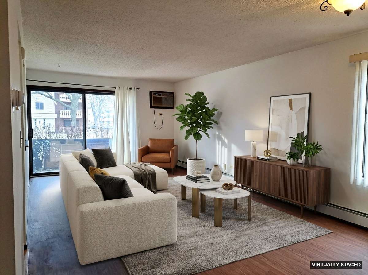 13 Timber Lane, Unit 1 Vernon Hills, IL 60061 - Photo 5 of 13 a living room with furniture and a large window