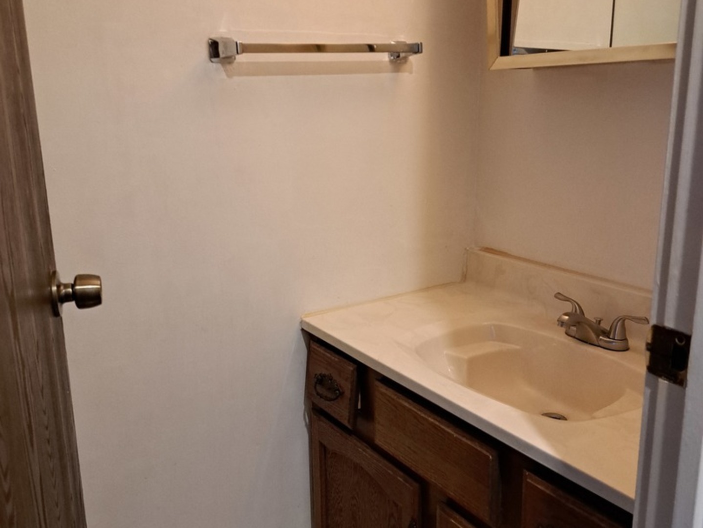 13 Timber Lane, Unit 1 Vernon Hills, IL 60061 - Photo 6 of 13 a bathroom with a sink and vanity