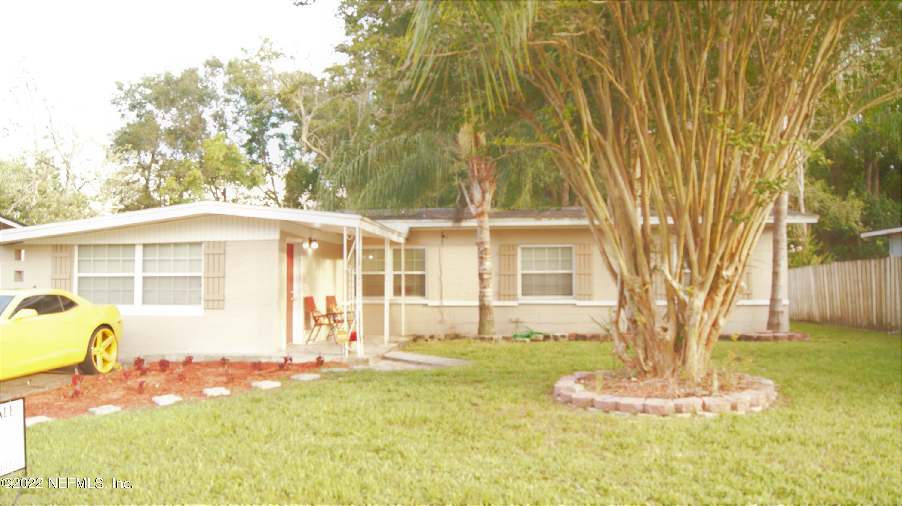 7506 Strato Road Jacksonville, FL 32210 - Photo 1 of 10 a front view of a house with a yard