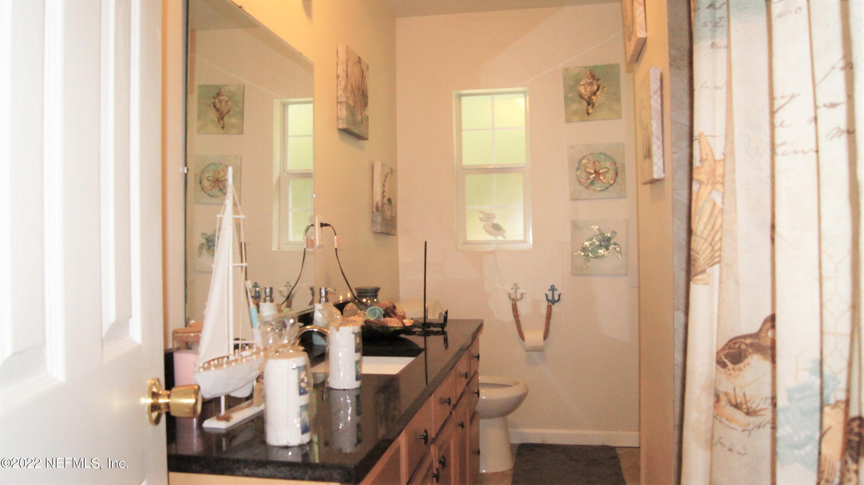 7506 Strato Road Jacksonville, FL 32210 - Photo 6 of 10 a view of a bathroom with a shower