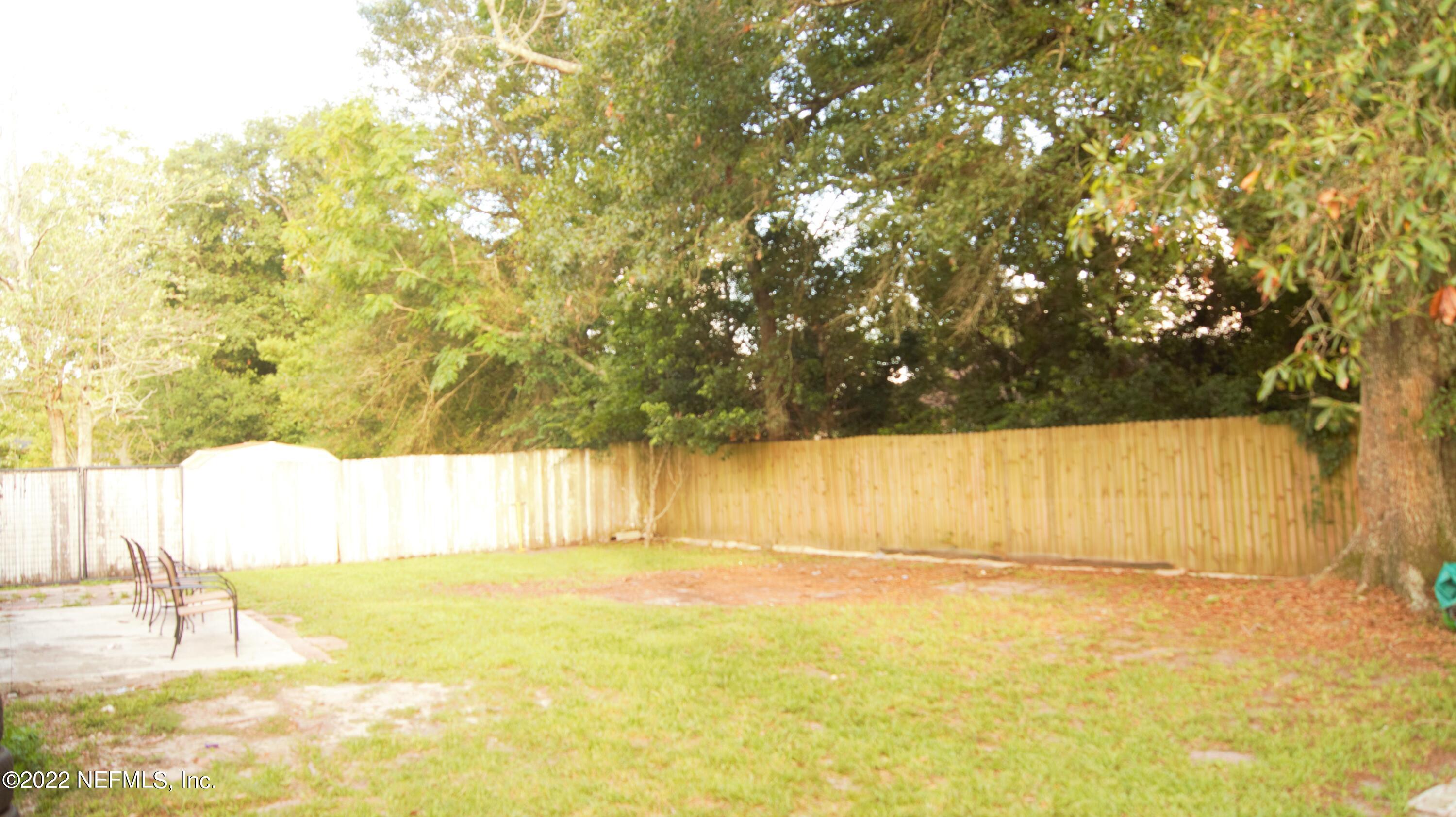 7506 Strato Road Jacksonville, FL 32210 - Photo 8 of 10 a view of swimming pool and brick wall