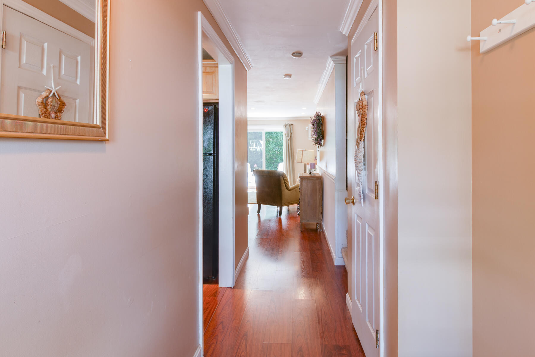 174 Lowell Road, Unit U14 Mashpee, MA 02649 - Photo 12 of 31 a view of a hallway with wooden floor and a bathroom