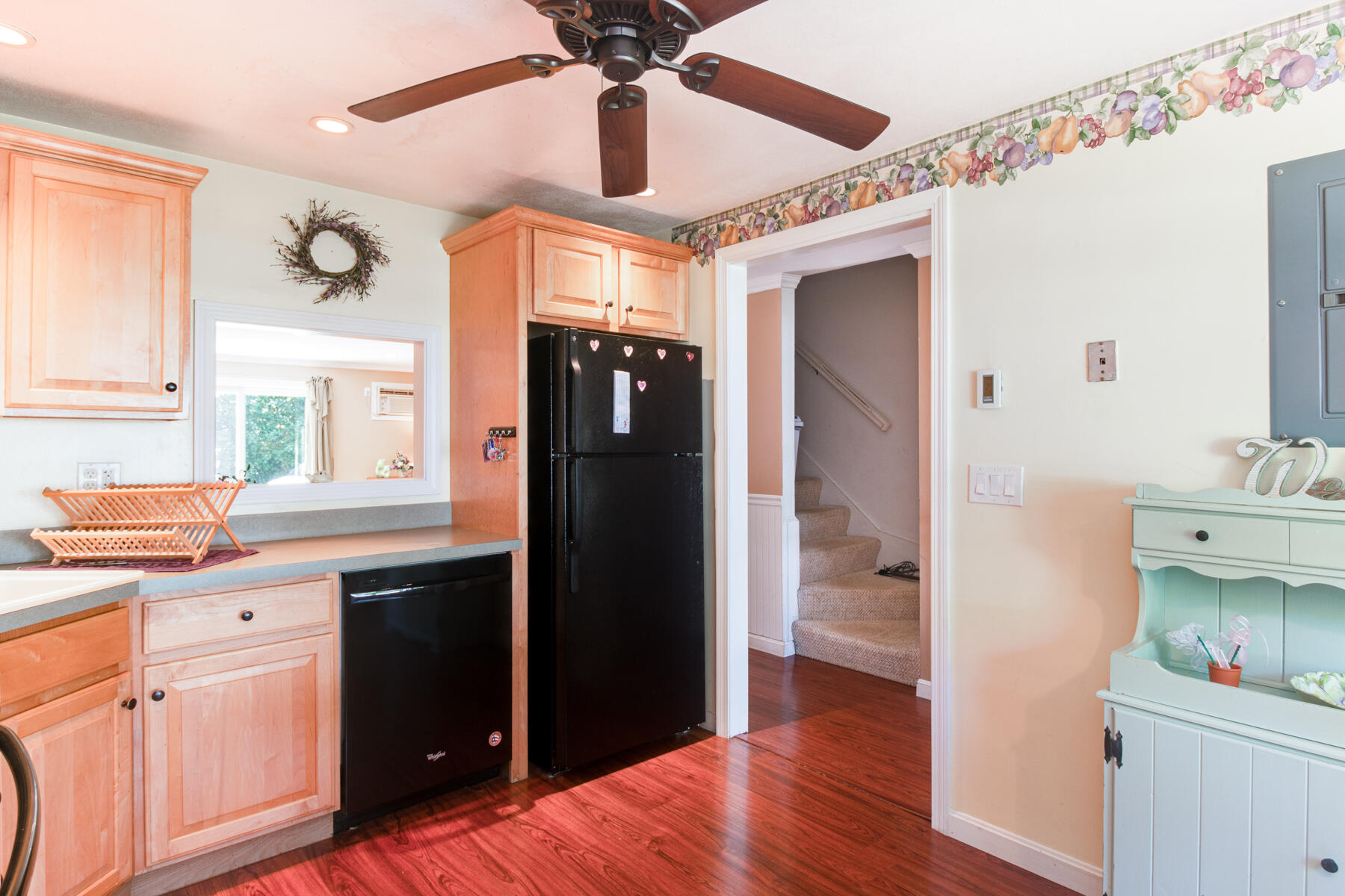 174 Lowell Road, Unit U14 Mashpee, MA 02649 - Photo 15 of 31 a kitchen with a refrigerator a sink and wooden floor