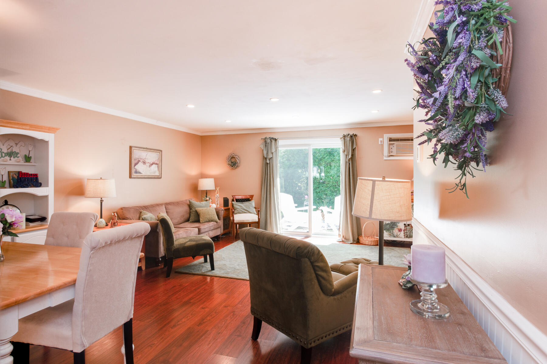 174 Lowell Road, Unit U14 Mashpee, MA 02649 - Photo 17 of 31 a living room with furniture a large window and wooden floor