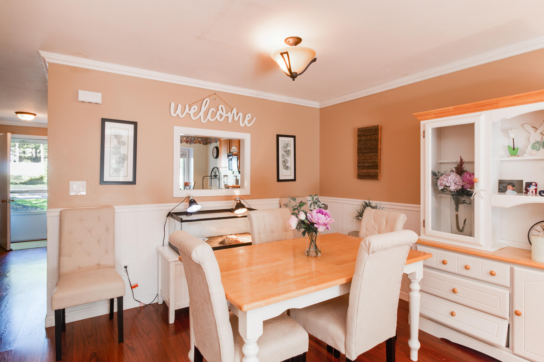 174 Lowell Road, Unit U14 Mashpee, MA 02649 - Photo 18 of 31 a view of a dining room with furniture and wooden floor