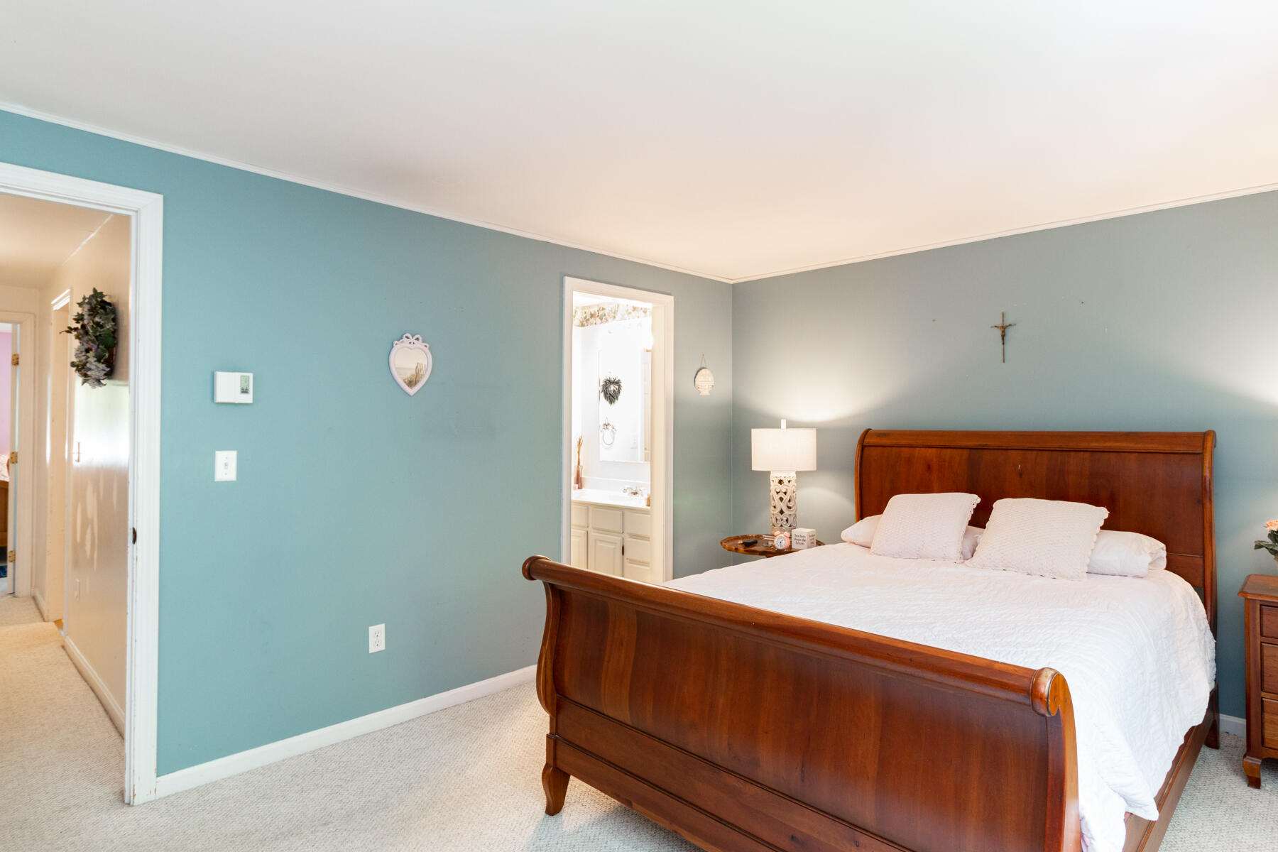 174 Lowell Road, Unit U14 Mashpee, MA 02649 - Photo 23 of 31 a bedroom with a bed and a lamp