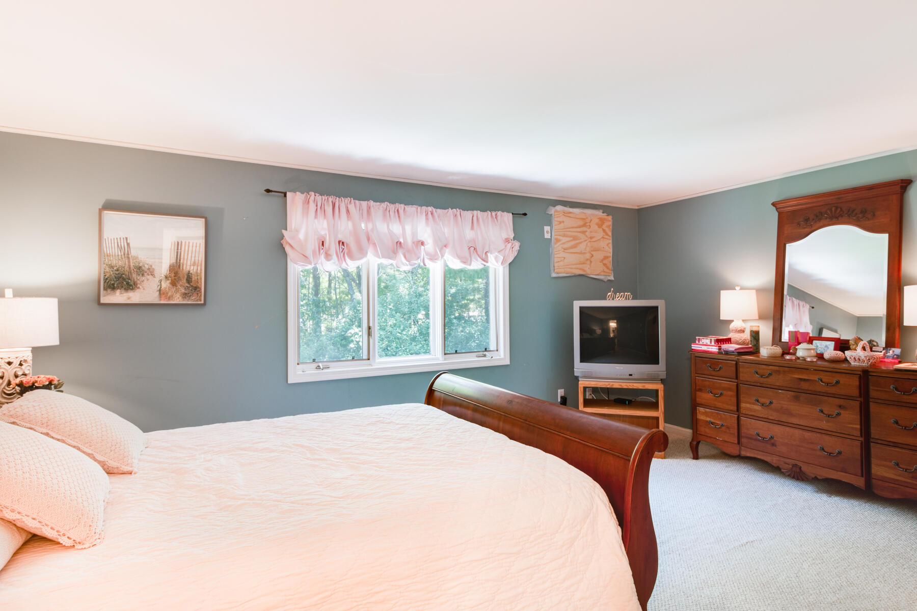 174 Lowell Road, Unit U14 Mashpee, MA 02649 - Photo 24 of 31 a bedroom with a bed and a flat screen tv