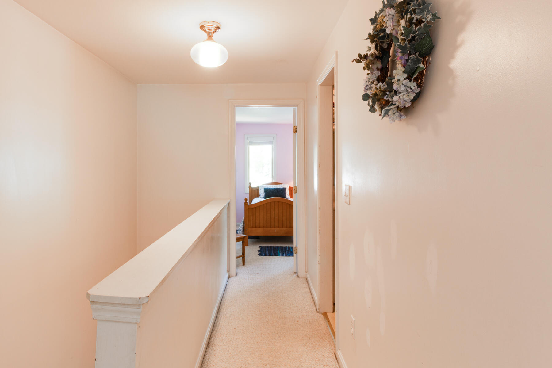 174 Lowell Road, Unit U14 Mashpee, MA 02649 - Photo 28 of 31 a bedroom with a bed and a chandelier