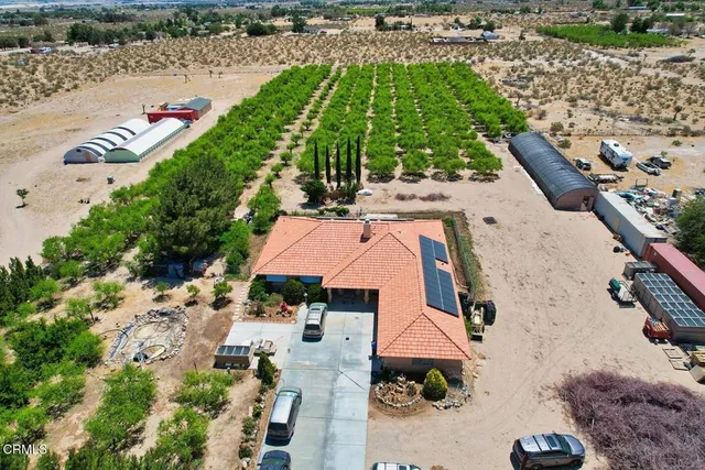 an aerial view of house with yard
