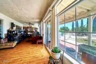 an outdoor space with furniture and garden