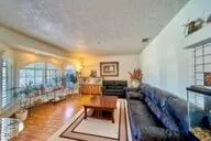 a living room with furniture and a table